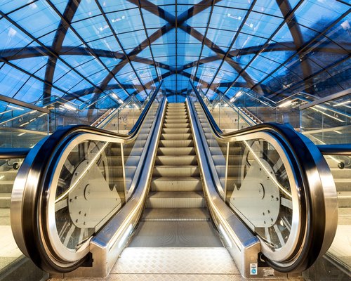 Commuter choosing stairs instead of an escalator in a modern building